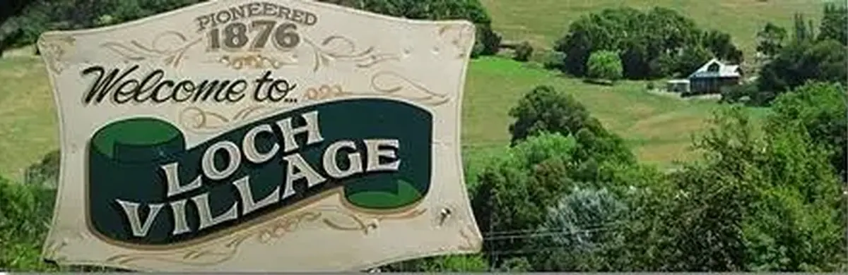 The welcome sign at Loch Village