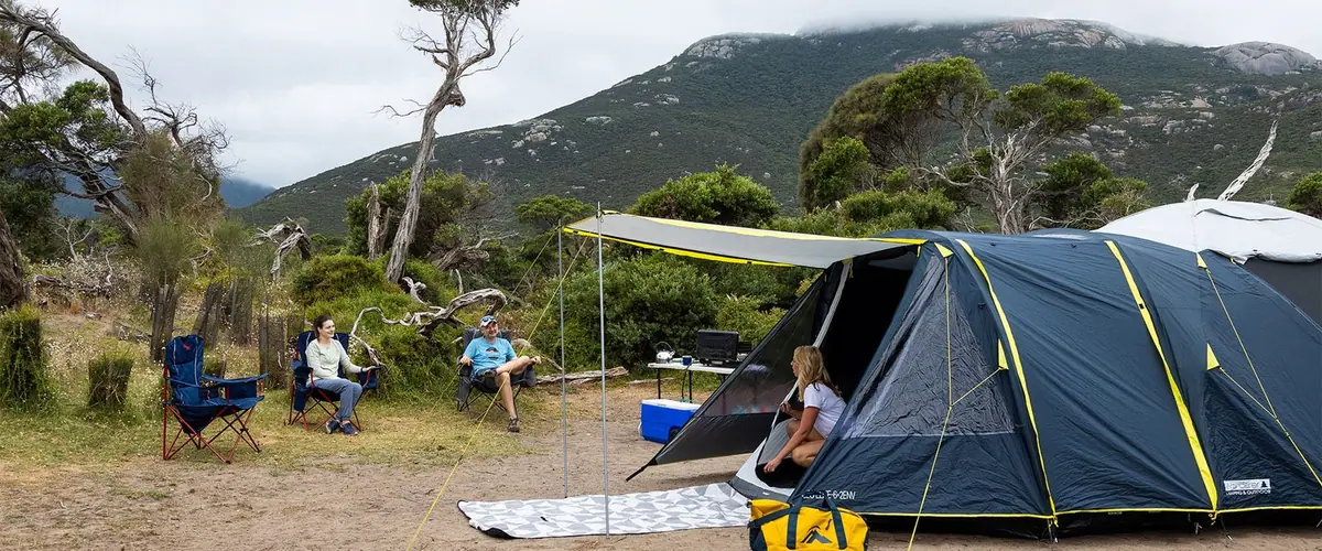 Tents pitched beneath the mountains of Wilsons Promontory